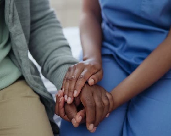 elder care holding hands compassion support at home